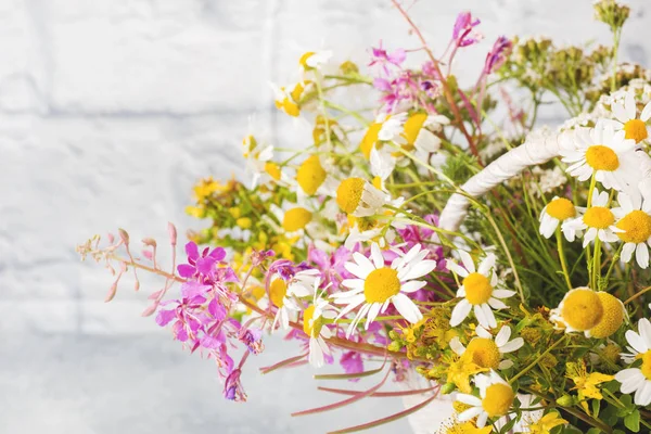 Bouquet of beautiful wildflowers in a basket on a gray background with copy space. — Stock Image Bouquet of beautiful wildflowers in a basket on a gray background with copy space. Royalty Free Stock Photos