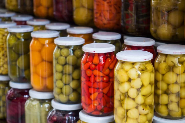 Istanbul, Turkey - September 03, 2019: Canned fruits and vegetables in glass jars in a shop window in Istanbul. Fermentation of food. — Stock Photo, Image