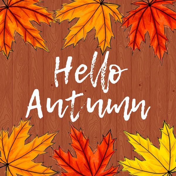 Calligraphie blanche Bonjour l'automne entouré de feuilles d'érable jaunes, orange et rouges. Lettrage à la main au milieu du feuillage d'automne. Fond brun en bois. Réseaux sociaux carrés — Photo