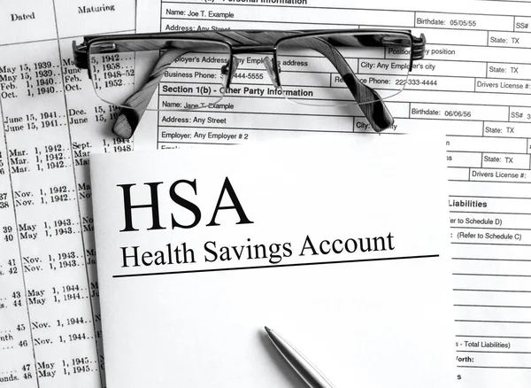 Paper with text HSA Health Savings Account on a table