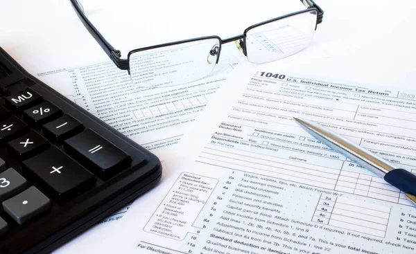 Tax Form 1040 Silver Pen Glasses Calculator Stock Picture