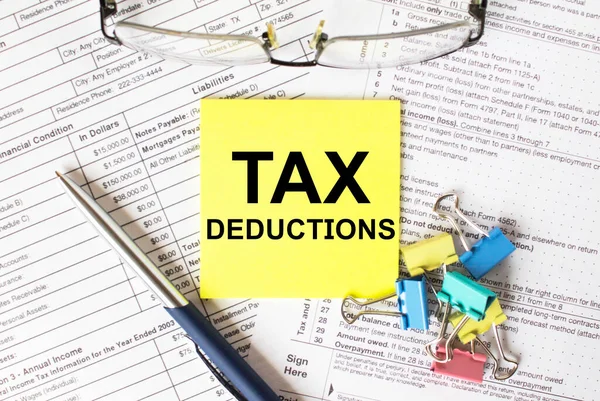 Yellow Sticker Text Tax Deductions Next Blue Pen Colored Stationery — Stock Photo, Image