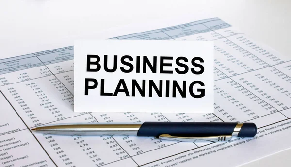 Κείμενο Business Planning Λευκή Κάρτα Μπλε Μεταλλικό Στυλό Στο Οικονομικό — Φωτογραφία Αρχείου