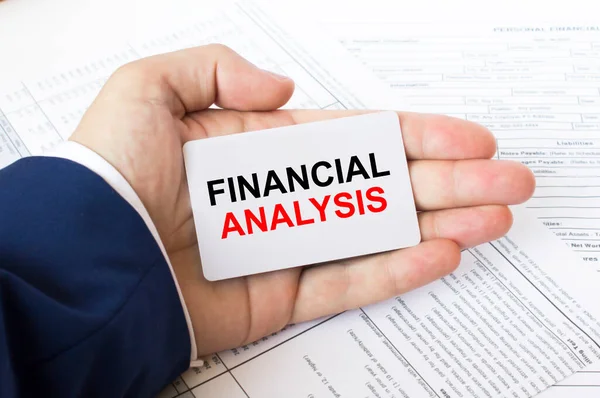 Man Hand Financial Tables Holding Business Card Inscription Financial Analysis — Stock Photo, Image