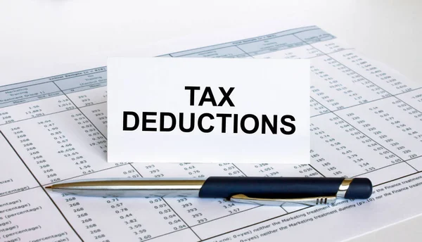 Text Tax Deductions White Card Blue Metal Pen Financial Table — Stock Photo, Image