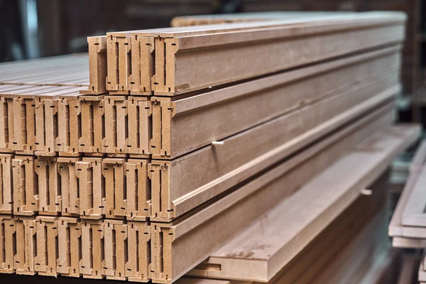 Joinery. Wood door manufacturing process. Stacked door architraves. Furniture manufacture.