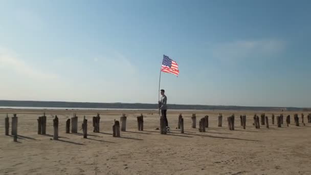 Guy Suit Rides Gyro Board Corridor Wooden Posts Holding Flagpole — Stock Video