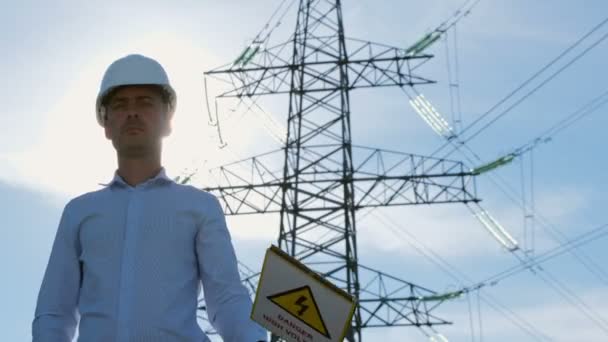 Power Engineer White Protective Helmet Raises Sign Dangerous High Voltage — Stock Video