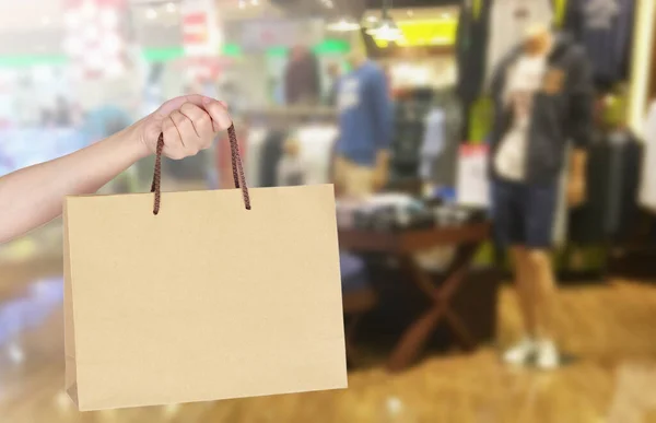 Woman with shopping bag in store