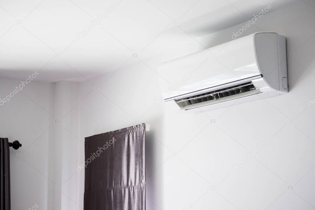 Air conditioner on white wall room interior background