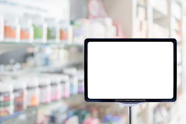 Blank price board sign display in Pharmacy drug store with blur medicine on shelves, health care medical background