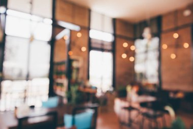 Bokeh ışıkları odaklı bulanık kafeterya restoranı.