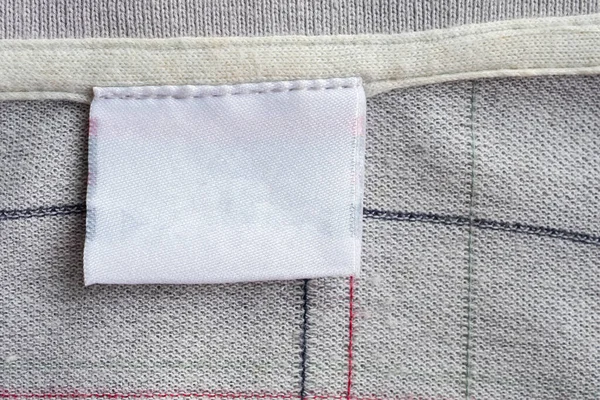 Wäschepflege Bekleidungsetikett Auf Textur — Stockfoto