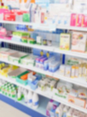 Pharmacy drugstore blur abstract backbround with medicine and healthcare product on shelves clipart