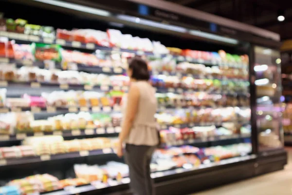 Abstract supermarket grocery store blurred defocused background with bokeh light