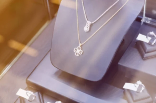 Blur Jewelry diamond necklace in jewelry shop store window display showcase, jewelry diamond