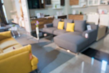 Ev dekorasyonu mobilya galerisindeki soyut bulanık kanepe montaj ürün gösterimi için bokeh ışığı arka planına sahip.