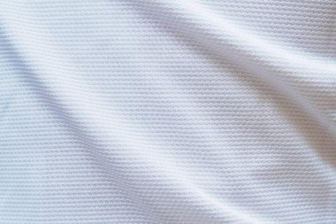 Beyaz futbol forması kumaş kumaş dokuma spor giysisi arka plan, yakın çekim
