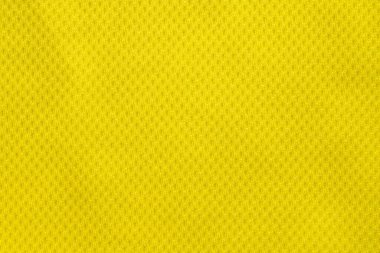 Sarı renkli futbol forması kumaş kumaş kumaş spor giysisi arka plan, yakın çekim