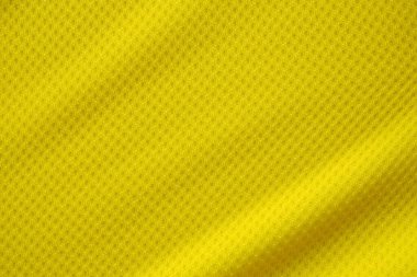 Sarı renkli futbol forması kumaş kumaş kumaş spor giysisi arka plan, yakın çekim