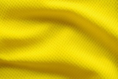 Sarı renkli futbol forması kumaş kumaş kumaş spor giysisi arka plan, yakın çekim