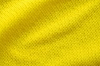 Sarı renkli futbol forması kumaş kumaş kumaş spor giysisi arka plan, yakın çekim