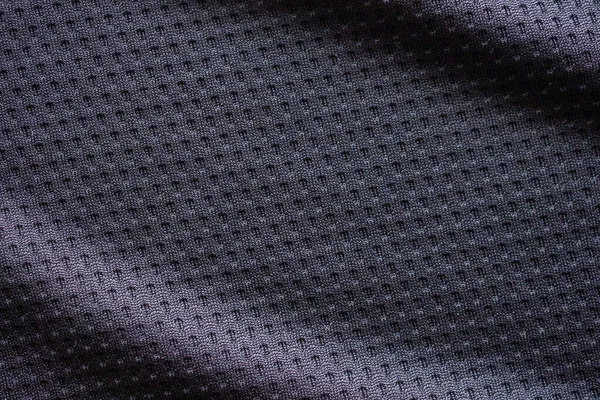 有空气网纹理背景的黑色面料运动服足球球衣 — 图库照片