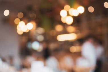 Soyut Bokeh ışıkları odaklanmış bulanık arkaplanı olan kafe restoranı
