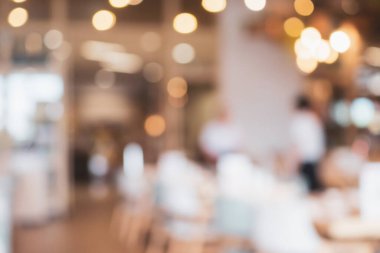 Soyut Bokeh ışıkları odaklanmış bulanık arkaplanı olan kafe restoranı