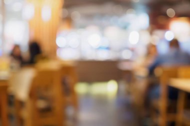 Kafe restoranındaki bulanık müşteriler ya da Bokeh Light 'lı soyut arka plan
