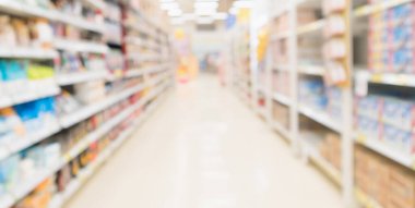 Soyut bulanık süpermarket indirimli mağaza koridoru ve ürün rafları iç odaklanmış arka plan