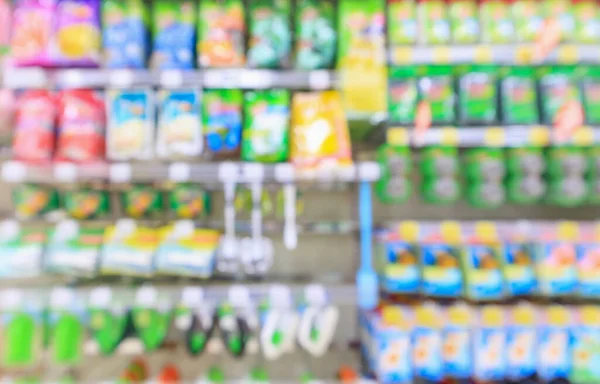 Abstract blur supermarket discount store cleaning tool product shelves interior defocused background