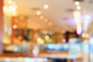 Bokeh ışıkları odaklı bulanık kafeterya restoranı.