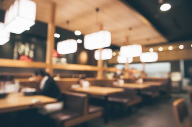 Bokeh ışıkları odaklı bulanık kafeterya restoranı.