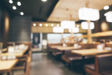 Bokeh ışıkları odaklı bulanık kafeterya restoranı.