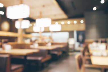 Bokeh ışıkları odaklı bulanık kafeterya restoranı.