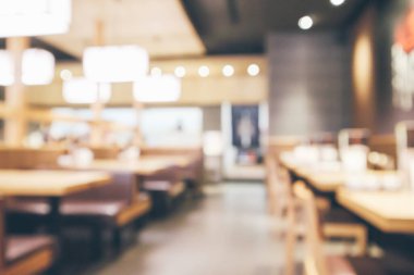 Bokeh ışıkları odaklı bulanık kafeterya restoranı.