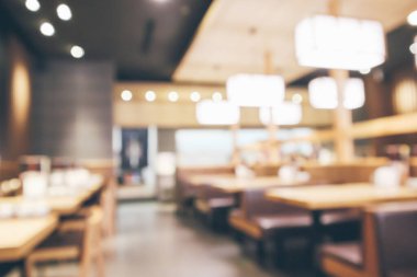 Bokeh ışıkları odaklı bulanık kafeterya restoranı.