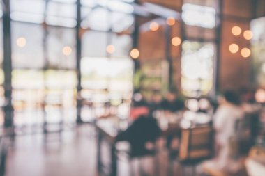 Montaj ürün görüntüleme arka planı için müşteri bulanıklığı olan restoran kafesi ya da kahve dükkânı içi soyut vintage bokeh ışığı