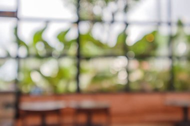 Montaj ürünü gösterimi için bokeh lambalı soyut bulanık kahve dükkanı ya da kafeterya arka planı