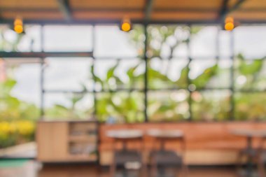 Montaj ürünü gösterimi için bokeh lambalı soyut bulanık kahve dükkanı ya da kafeterya arka planı