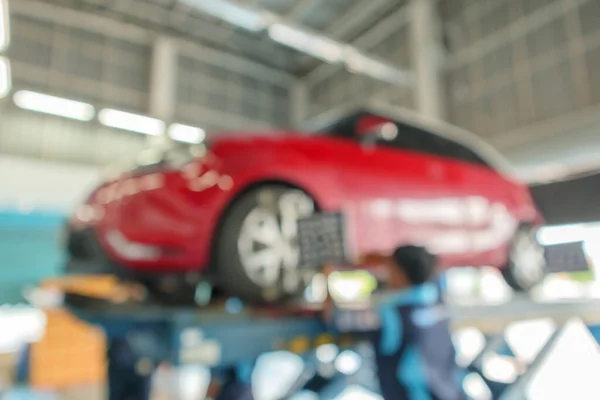 Abstrakte Verwischung Roter Autoräder Gange Auto Reparatur Center Hintergrund — Stockfoto