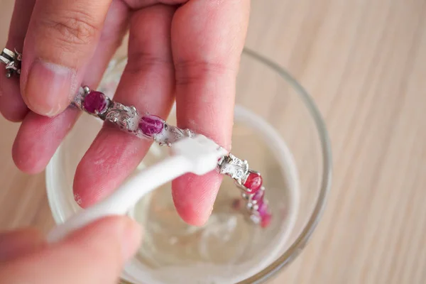 Jeweller Hand Cleaning Polishing Vintage Jewelry Red Ruby Bracelet Closeup — Stock Photo, Image