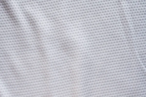ホワイトファブリックスポーツウェアエアメッシュテクスチャの背景を持つサッカージャージ — ストック写真