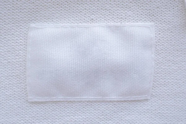 Etiqueta Roupas Brancas Branco Fundo Camisa Nova — Fotografia de Stock