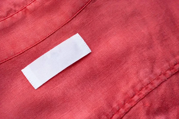Etiqueta Etiqueta Roupa Branca Branco Fundo Textura Tecido Camisa Linho — Fotografia de Stock