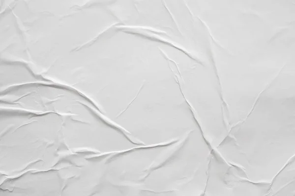 Blank white crumpled and creased paper poster texture background