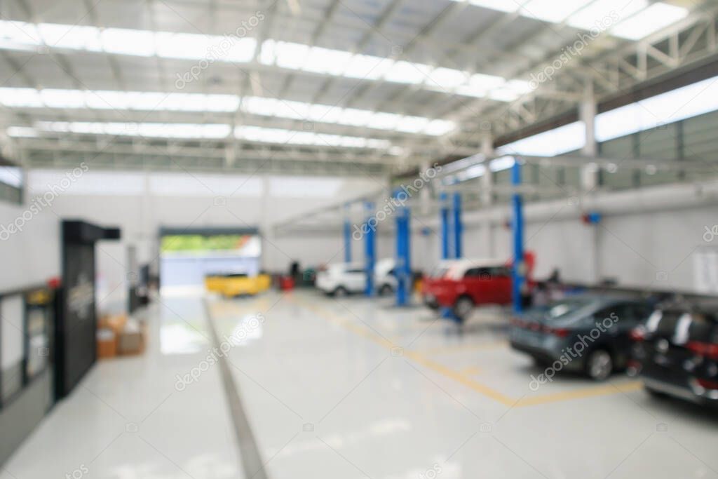 car service centre with auto at repair station bokeh light defocused blur background