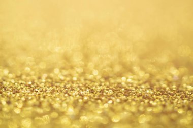 Soyut Altın Işıltılı Noel arkaplanı Bokeh ışığı ile bulanıklaşıyor