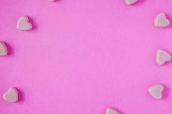 valentine candy hearts shape on pink background